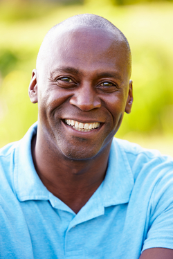 smiling man in blue shirt